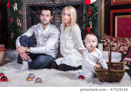 Happy family celebrating Christmas Happy family celebrating Christmas 47329326