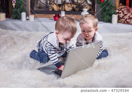 Two cute children using laptop 47329584