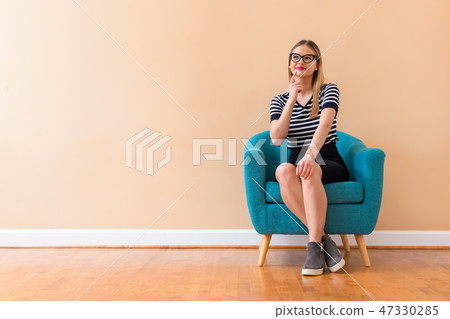 Young woman in a thoughtful pose 47330285