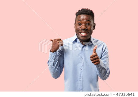 The happy businessman standing and smiling against pink background. 47330641