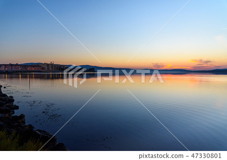 View of sunrise in lagoon Orbetello 47330801