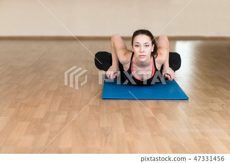 woman yoga, Bhekasana, Frog Pose in gym 47331456