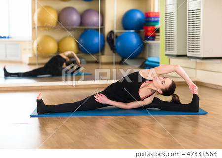 woman practicing yoga Forward Bend Pose woman practicing yoga Forward Bend Pose 47331563