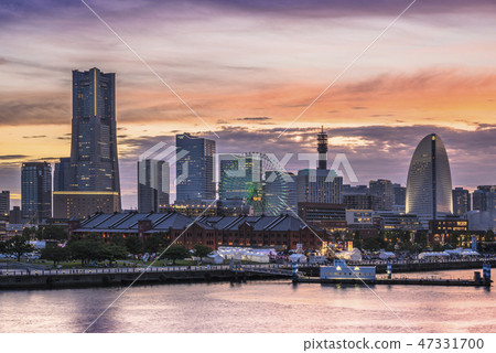 A sunset setting in Minato Mirai in Yokohama seen from Oosan Bridge. A sunset setting in Minato Mirai in Yokohama seen from Oosan Bridge. 47331700