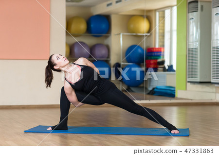 Woman yoga pose Ashva sanchalanasana 47331863