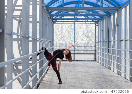 sports woman doing stretching outdoors sports woman doing stretching outdoors 47332026