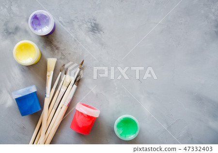 Set of clean paint brushes and multicolor paints. Set of clean paint brushes and multicolor paints. 47332403