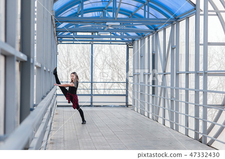 sports woman doing stretching outdoors sports woman doing stretching outdoors 47332430