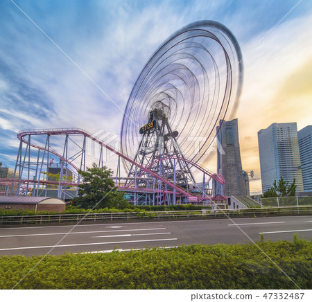 Cosmo World Ferris wheel Cosmo Clock 21 next to the Minato Mirai International Bridge in Yokohama 21. Cosmo World Ferris wheel Cosmo Clock 21 next to the Minato Mirai International Bridge in Yokohama 21. 47332487