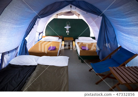 Inside a large tourist tent with luxurious furnishings 47332856