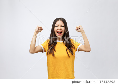 Asian women happiness hand up with winning or success something. 47332898