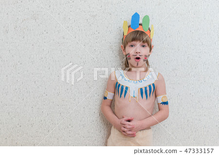 Blond boy playing injun Blond boy playing injun 47333157