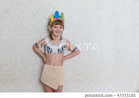 Blond boy playing injun Blond boy playing injun 47333185