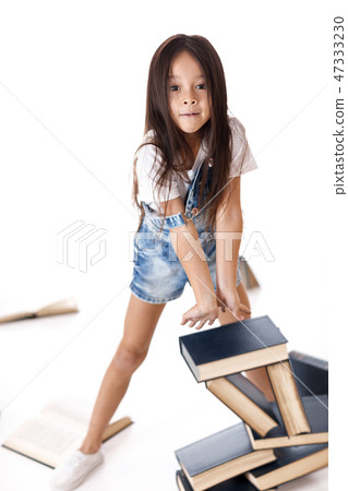cute little girl is reading a book. cute little girl is reading a book. 47333230
