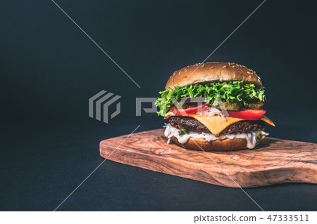 cornflakes cereal and milk in a glass. 47333511