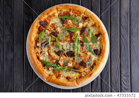 Pizza with various kinds of cheese 47333572