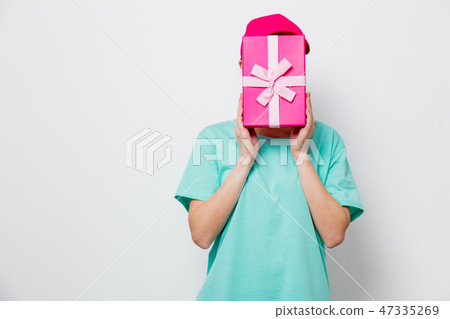 young girl with holiday present box 47335269