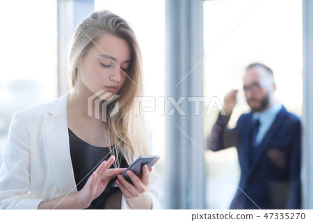 A man and a woman at the entrance to the office door are talking, acquaintance. A man and a woman at the entrance to the office door are talking, acquaintance. 47335270