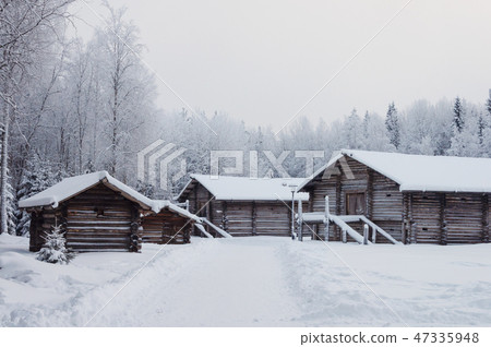 Old wooden houses with barns in North Russia 47335948