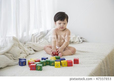 Little two cute babies photo. Baby wearing diaper in white bedroom. 268 Little two cute babies photo. Baby wearing diaper in white bedroom. 268 47337853