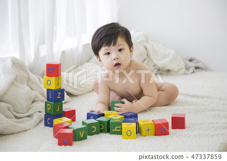 Little two cute babies photo. Baby wearing diaper in white bedroom. 282 Little two cute babies photo. Baby wearing diaper in white bedroom. 282 47337859