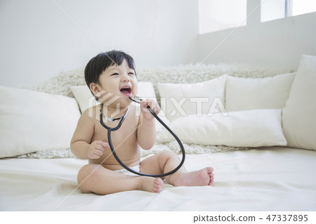 Little two cute babies photo. Baby wearing diaper in white bedroom. 274 Little two cute babies photo. Baby wearing diaper in white bedroom. 274 47337895
