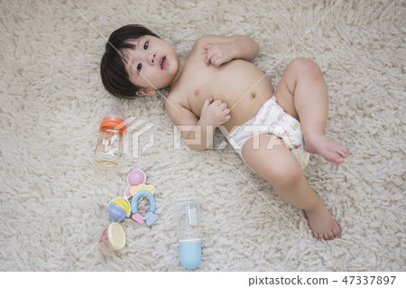 Little two cute babies photo. Baby wearing diaper in white bedroom. 234 Little two cute babies photo. Baby wearing diaper in white bedroom. 234 47337897