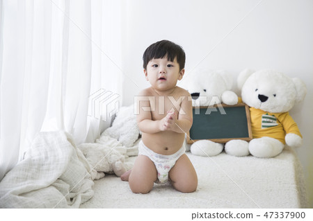 Little two cute babies photo. Baby wearing diaper in white bedroom. 264 Little two cute babies photo. Baby wearing diaper in white bedroom. 264 47337900