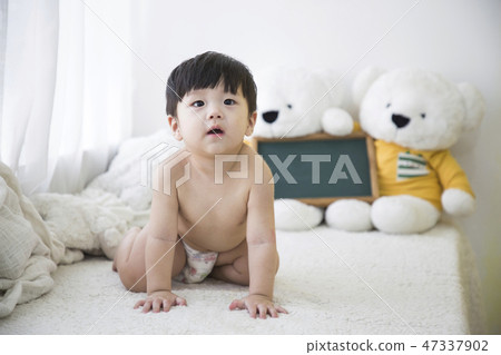 Little two cute babies photo. Baby wearing diaper in white bedroom. 283 47337902
