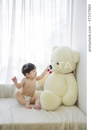 Little two cute babies photo. Baby wearing diaper in white bedroom. 218 Little two cute babies photo. Baby wearing diaper in white bedroom. 218 47337904