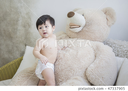 Little two cute babies photo. Baby wearing diaper in white bedroom. 216 Little two cute babies photo. Baby wearing diaper in white bedroom. 216 47337905