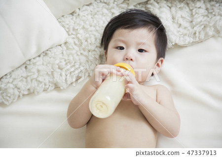 Little two cute babies photo. Baby wearing diaper in white bedroom. 208 Little two cute babies photo. Baby wearing diaper in white bedroom. 208 47337913