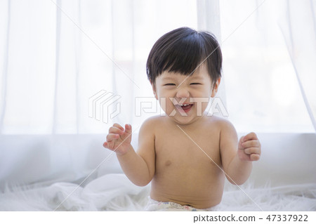Little two cute babies photo. Baby wearing diaper in white bedroom. 151 47337922