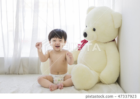 Little two cute babies photo. Baby wearing diaper in white bedroom. 238 Little two cute babies photo. Baby wearing diaper in white bedroom. 238 47337923