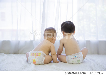 Little two cute babies photo. Baby wearing diaper in white bedroom. 124 Little two cute babies photo. Baby wearing diaper in white bedroom. 124 47337937