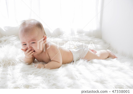 Little two cute babies photo. Baby wearing diaper in white bedroom. 011 47338001