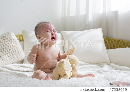 Little two cute babies photo. Baby wearing diaper in white bedroom. 110 Little two cute babies photo. Baby wearing diaper in white bedroom. 110 47338039