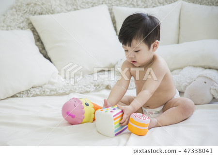 Little two cute babies photo. Baby wearing diaper in white bedroom. 270 Little two cute babies photo. Baby wearing diaper in white bedroom. 270 47338041