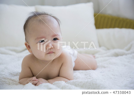 Little two cute babies photo. Baby wearing diaper in white bedroom. 109 Little two cute babies photo. Baby wearing diaper in white bedroom. 109 47338043