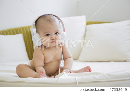 Little two cute babies photo. Baby wearing diaper in white bedroom. 072 47338049
