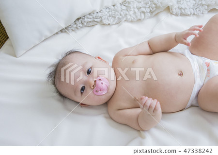 Little two cute babies photo. Baby wearing diaper in white bedroom. 135 Little two cute babies photo. Baby wearing diaper in white bedroom. 135 47338242