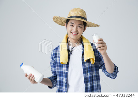Agriculture industry, farming and people concept. Young farmer gesturing over gray background. 120 47338244