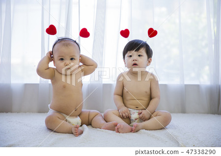 Little two cute babies photo. Baby wearing diaper in white bedroom. 108 Little two cute babies photo. Baby wearing diaper in white bedroom. 108 47338290