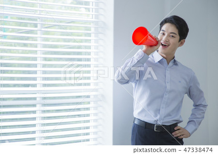 Portrait of a confident businessman' various gestures over gray background 047 47338474