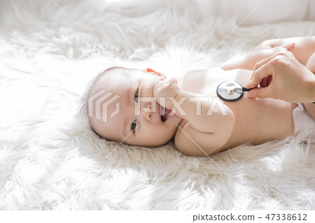 Little two cute babies photo. Baby wearing diaper in white bedroom. 034 47338612