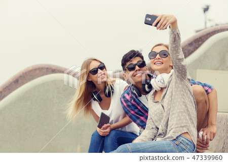 Make selfie photos with friends Make selfie photos with friends 47339960