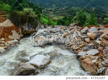 Strong and danger cold flowing river water Strong and danger cold flowing river water 47341887