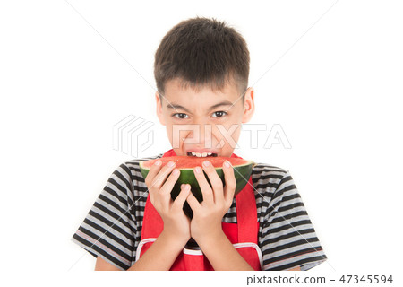 Little boys eat watermelon on white Little boys eat watermelon on white 47345594
