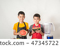 Little boys blend water melone juice by using blender at home 47345722