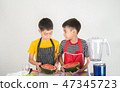 Little boys blend water melone juice by using blender at home 47345723